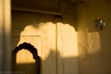 Sun light shinning through window to light up wall inside of temple at Sagar Lake.