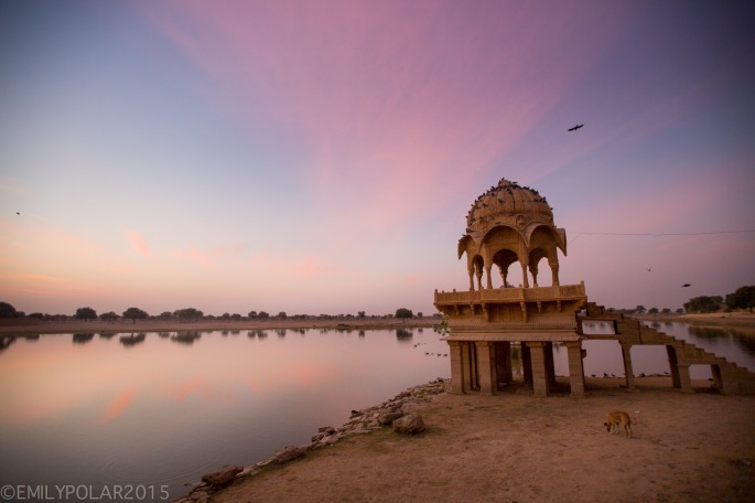 Warm light at sunrise over lake Sagar at Amar Sagar temple in Jaisalmer.